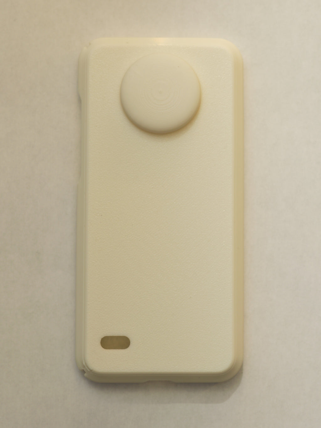 Beige electronic device on a beige background