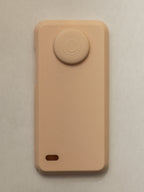 Beige phone case with a circular design on a beige background