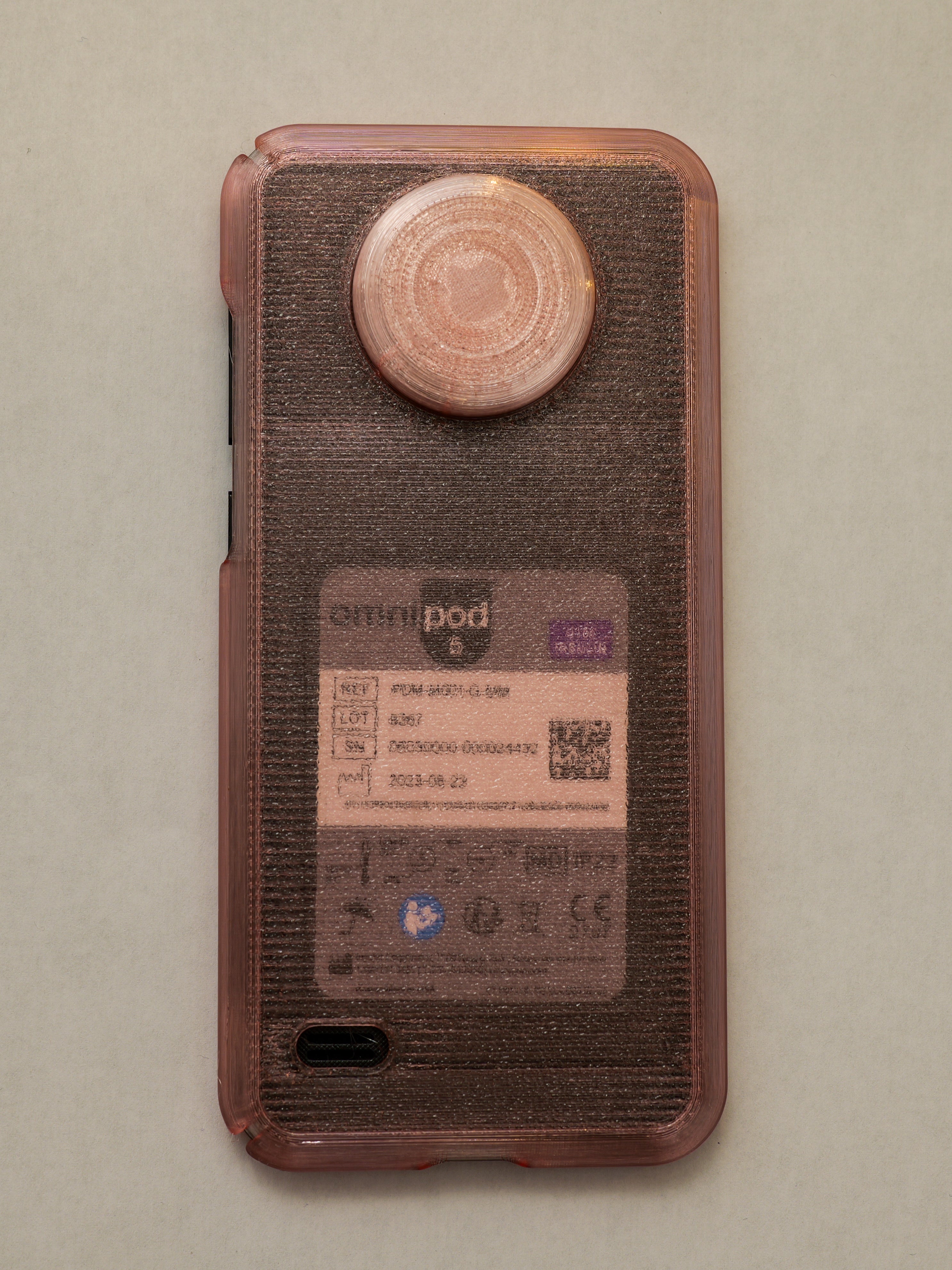 Phone case with a textured surface and visible branding on a beige background